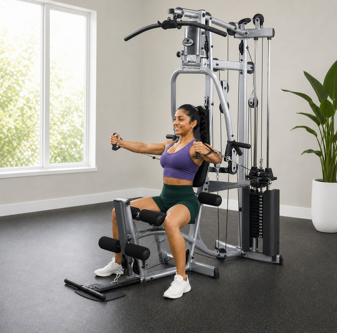 Alternate view of a fit model performing a seated chest press on the Powerline P2X
