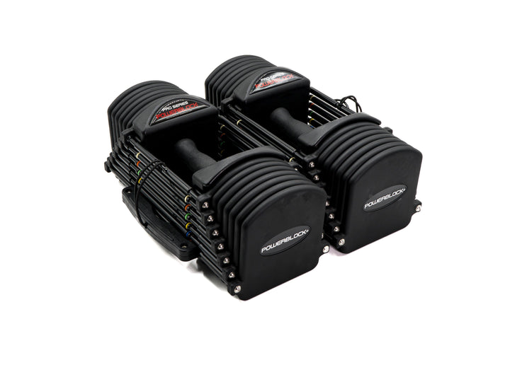 PowerBlock Commercial Pro 32 adjustable dumbbells shown as a pair, black urethane plates with contoured TPR handles