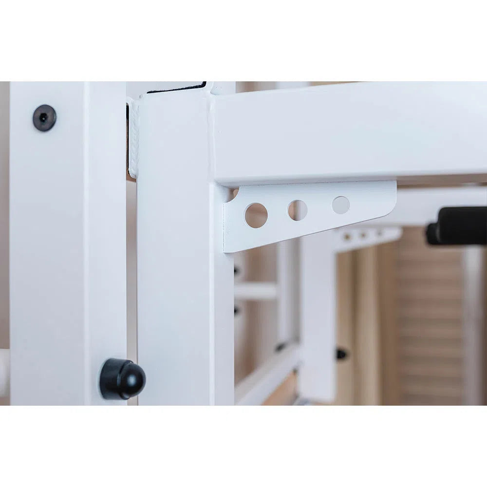 A close-up of the white adjustable bed frame reveals customizable settings with bracket holes, similar to BenchK Home Wall Bars w/ Flex Pull-Up Bar (731). The sturdy metal frame features European safety standards-compliant screws and rivets, set against a neutral background.