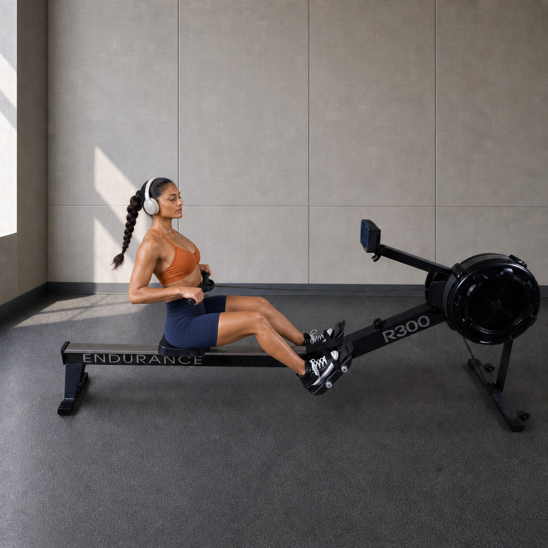 Body-Solid Endurance R300 commercial rower in use in a premium rehab studio