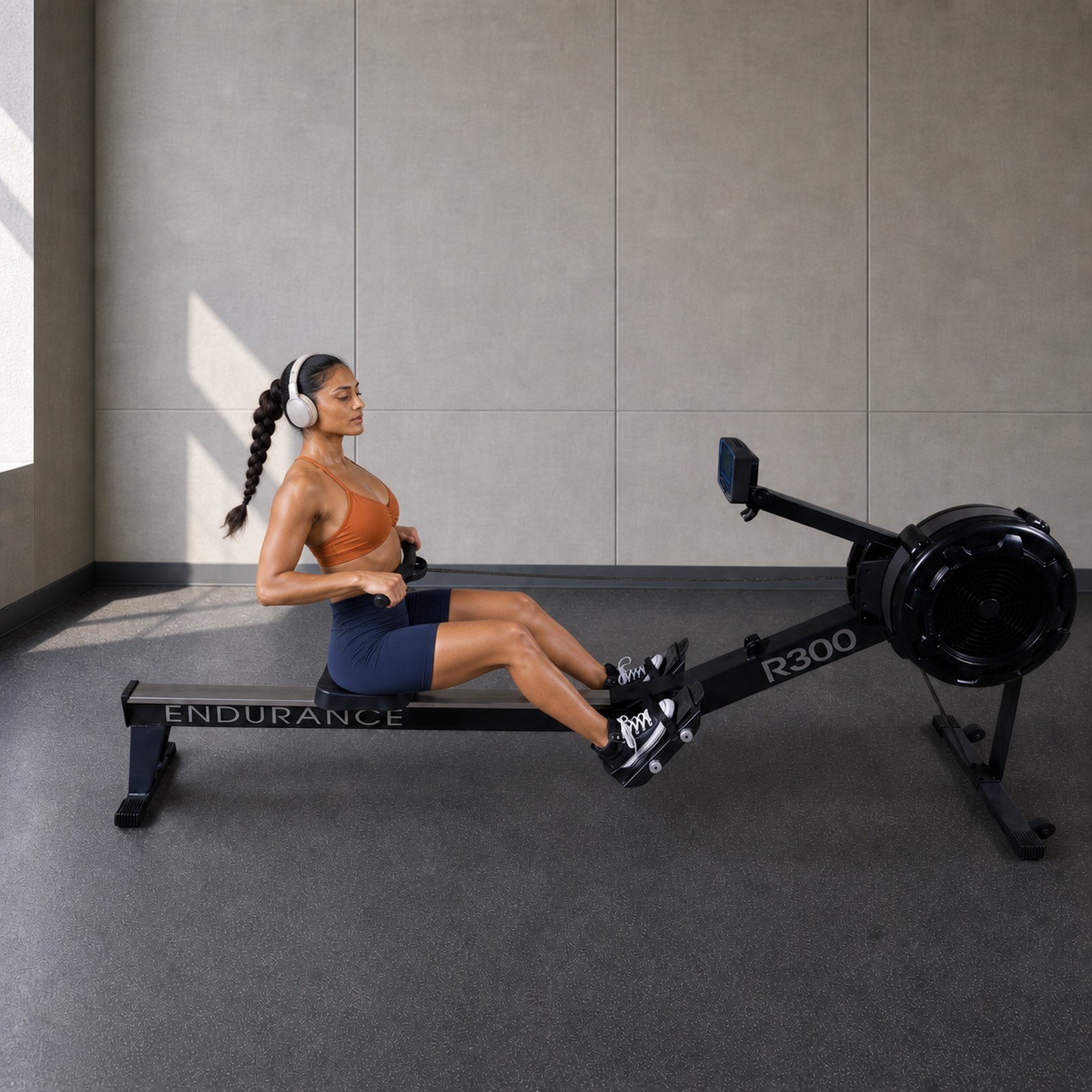 Body-Solid Endurance R300 commercial rower in use in a premium rehab studio
