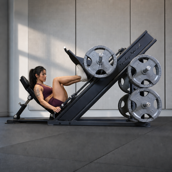 Body-Solid Pro ClubLine SGLP500 leg press with athlete training in a premium studio