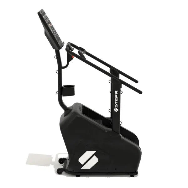 The STEPR Classic Stair Climber, by STEPR, is a sleek black exercise machine with handlebars and a digital display, ideal for home cardio workouts.