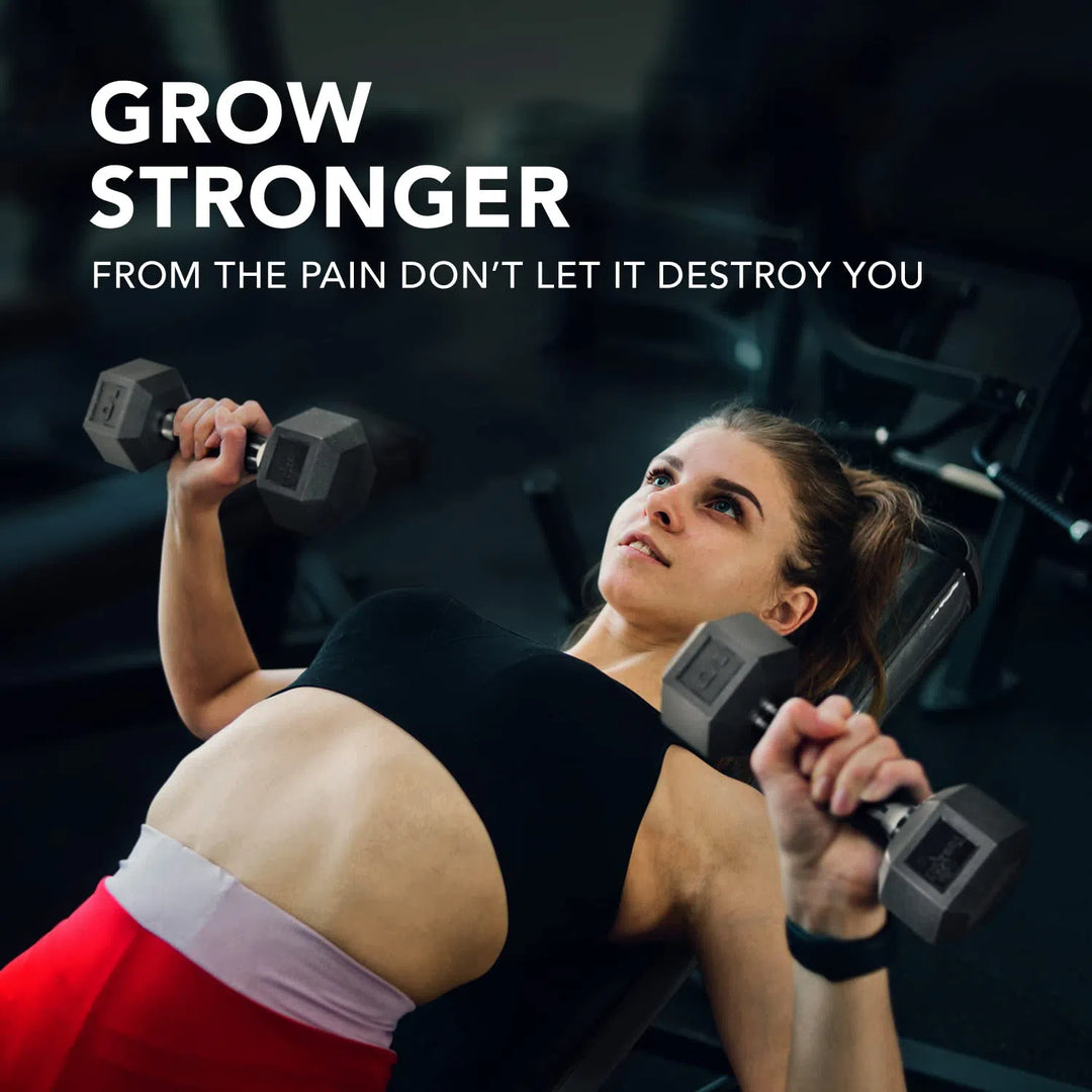 A woman in athletic gear lies on a bench, lifting Yes4All Rubber Grip Encased Hex Dumbbells with a solid cast-iron core. The text reads, Grow stronger from the pain, dont let it destroy you, while her determined expression is emphasized by the blurred background.